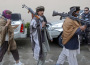 Members of the Taliban voluntarily hand over their weapons and join a peace reconciliation program in Jalalabad province