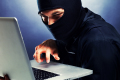 Computer hacker - Male thief stealing data from laptop