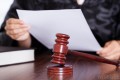 judge-holding-piece-of-paper